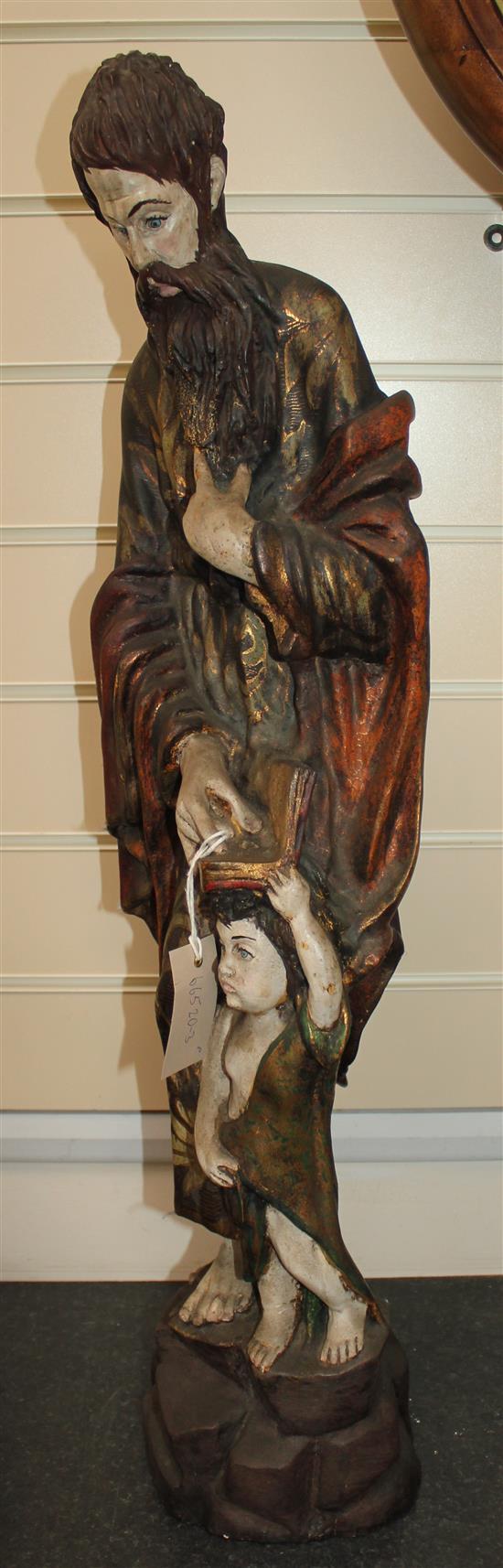 A 20th century carved and polychrome painted figure of a Saint, 31in.